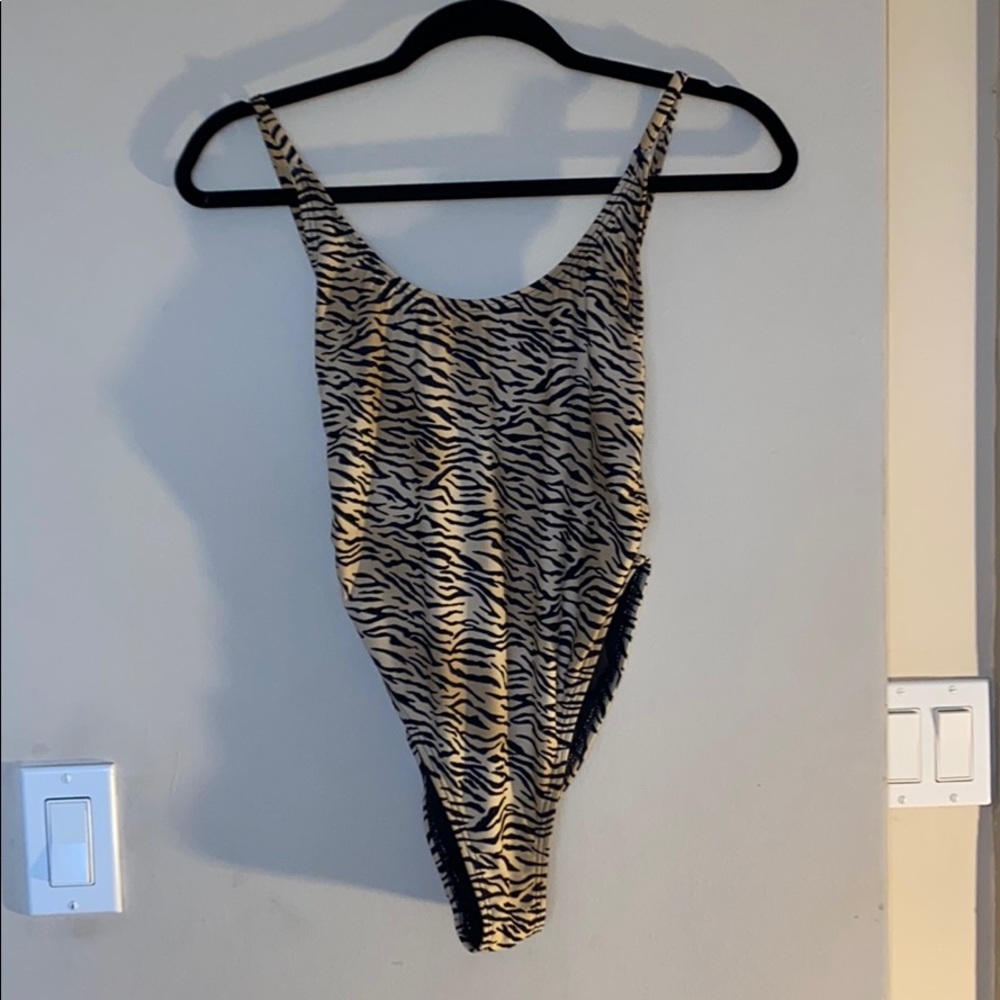 New. Bought in New Zealand. 🐯 swim suit.